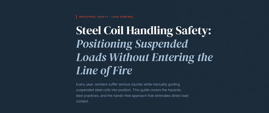 Workers using a hands-free load control tool for steel coil handling safety during suspended coil positioning in a steel plant.